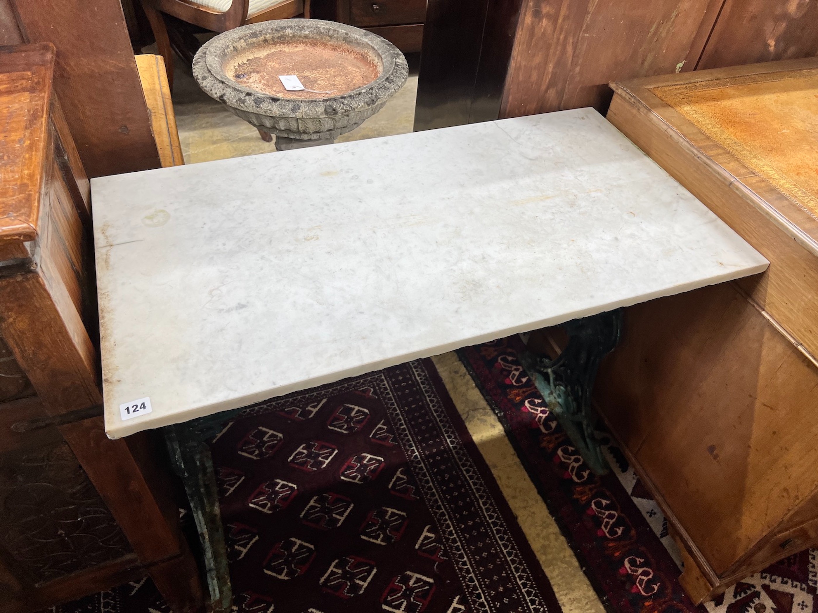 A rectangular marble top cast iron garden table, length 91cm, width 48cm, height 70cm